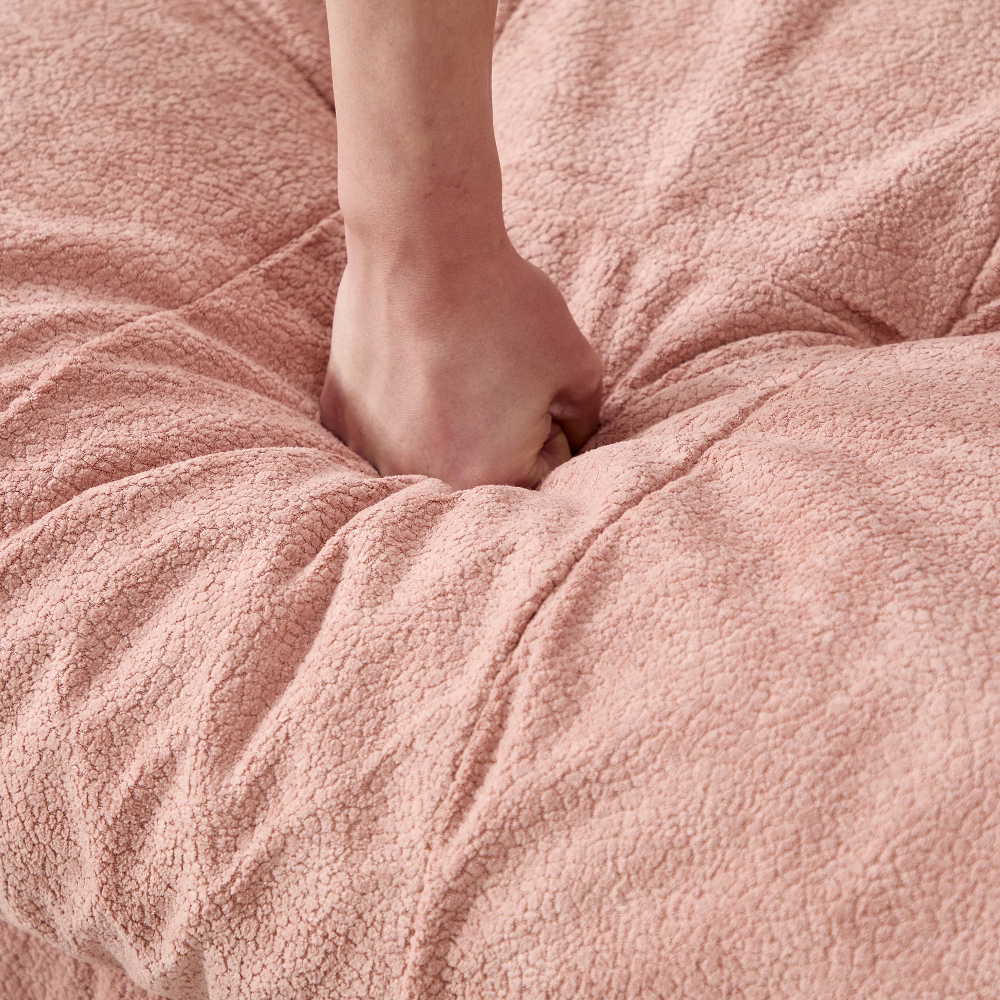 U Shaped Couch Modular Sectional Sofa pink plush upholstery closeup with bare foot on fabric on Tampa Home & Garden Store