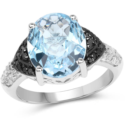 Ring with oval blue topaz center, black diamond halo and white topaz accents in sterling silver on Tampa Home & Garden Store