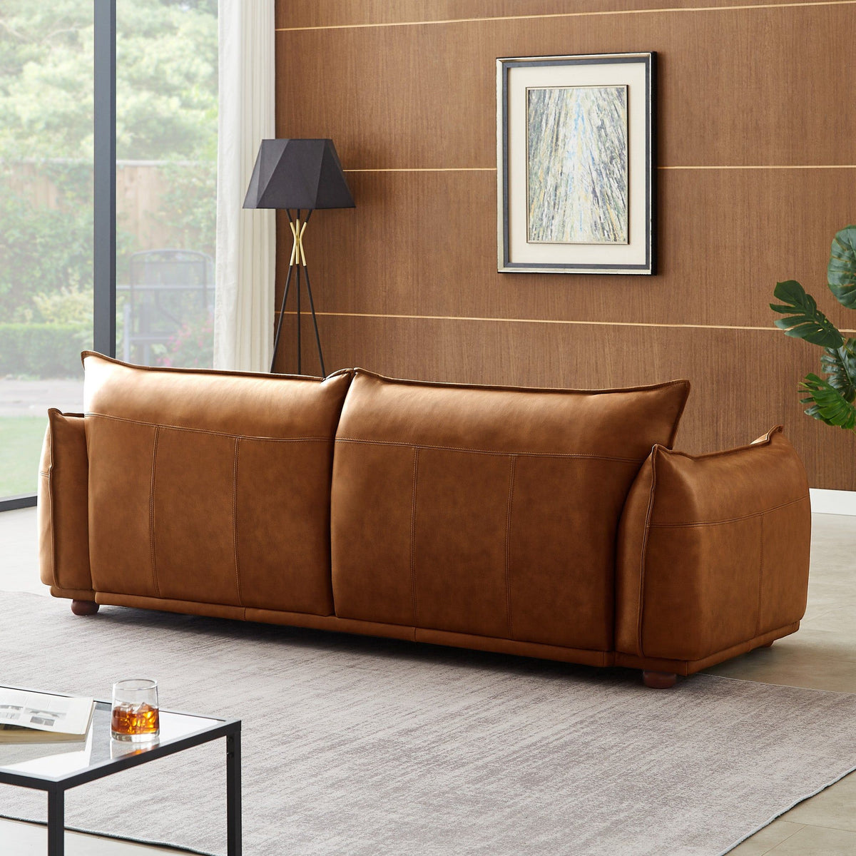 HouseOfZazla mid-century modern luxury sofa in brown leather with tufted panels in living room on Tampa Home & Garden Store