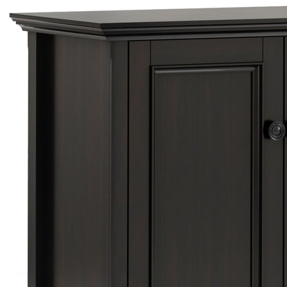 Amherst 4-door storage cabinet in black finish with paneled doors and round knob on Tampa Home & Garden Store