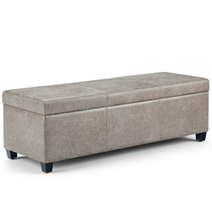 Avalon storage ottoman bench in gray textured faux leather with stitched seams and black feet on Tampa Home & Garden Store