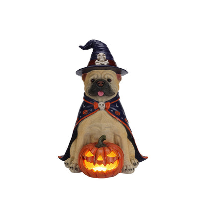 Tan bulldog Halloween statue in witch hat and cape holding a glowing jack-o-lantern pumpkin on Tampa Home & Garden Store