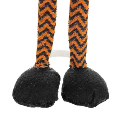 Standing gnome legs with orange and black zigzag striped fabric and fuzzy black feet on Tampa Home & Garden Store