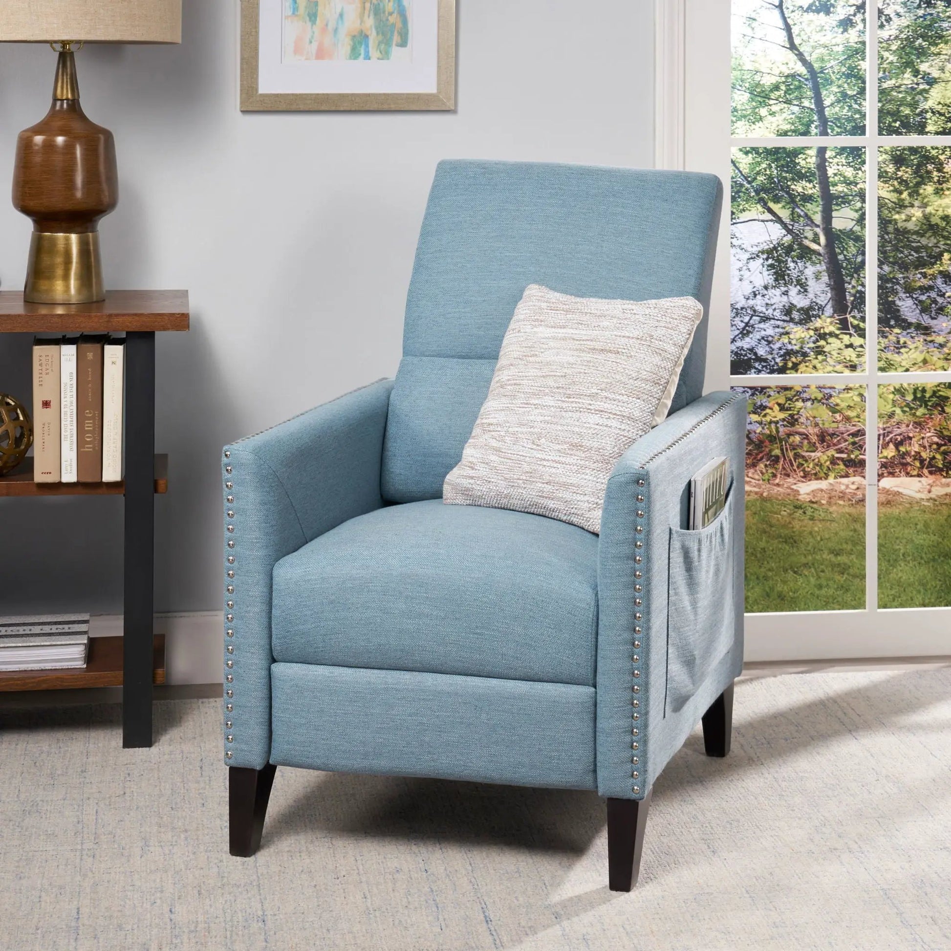 Repose upholstered recliner chair in light blue with nailhead trim and side pocket on Tampa Home & Garden Store