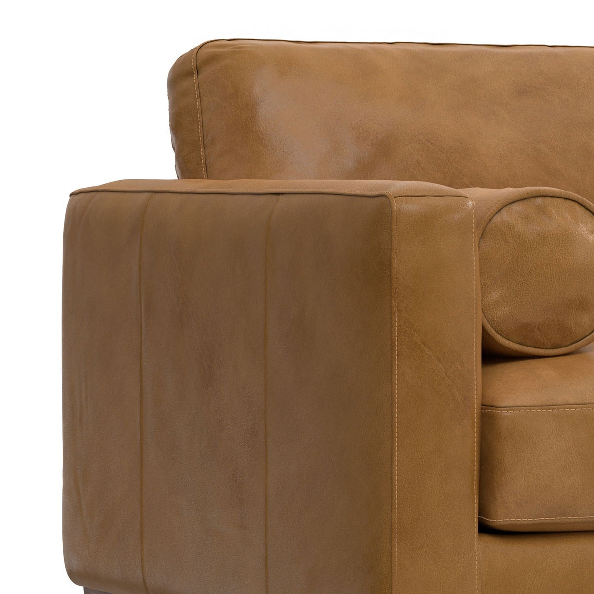 Wide tan leather arm chair with visible stitching and padded cushions on Tampa Home & Garden Store