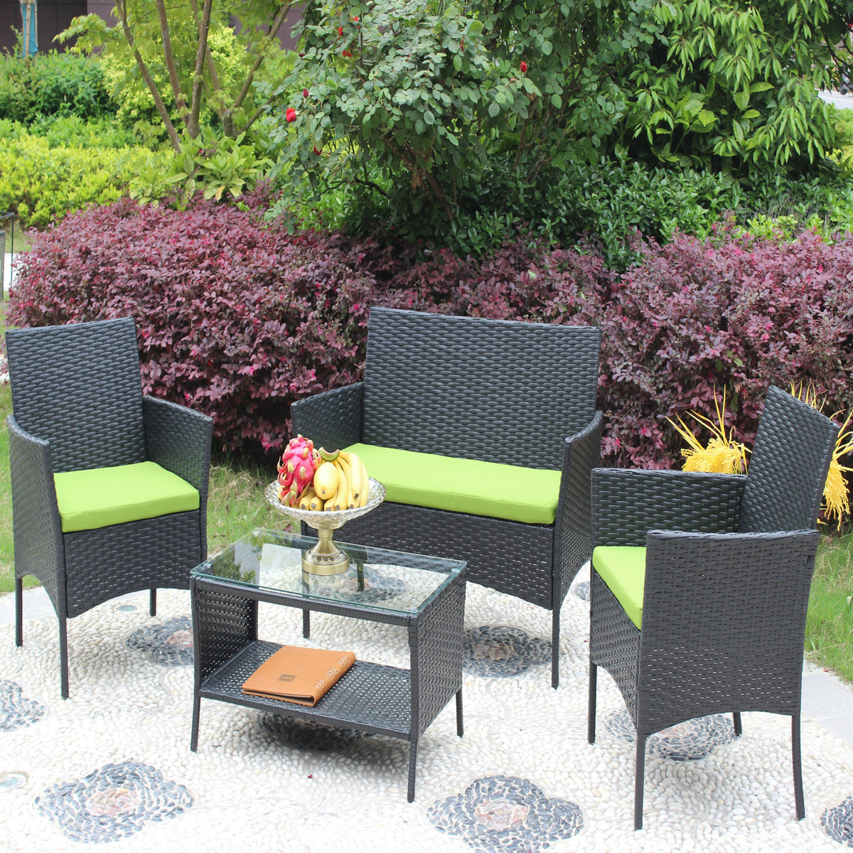 4pc HouseOfZazla rattan outdoor furniture set with black wicker and lime green cushions on patio on Tampa Home & Garden Store
