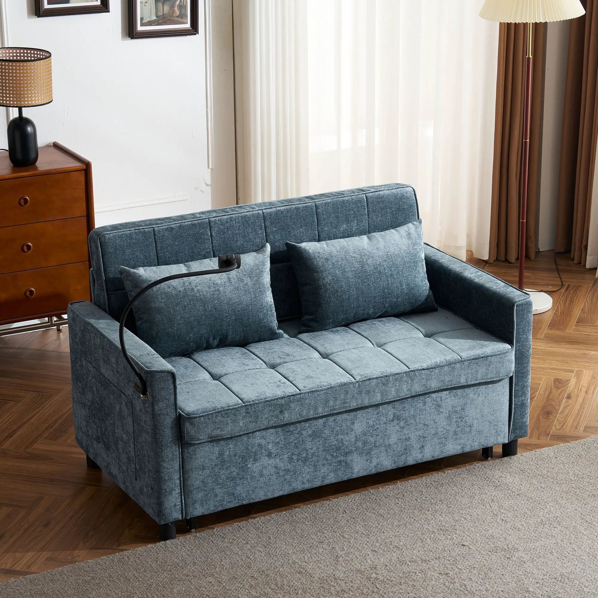 Pull-out sleeper sofa in blue denim fabric with tufted cushions and cushioned arms on Tampa Home & Garden Store