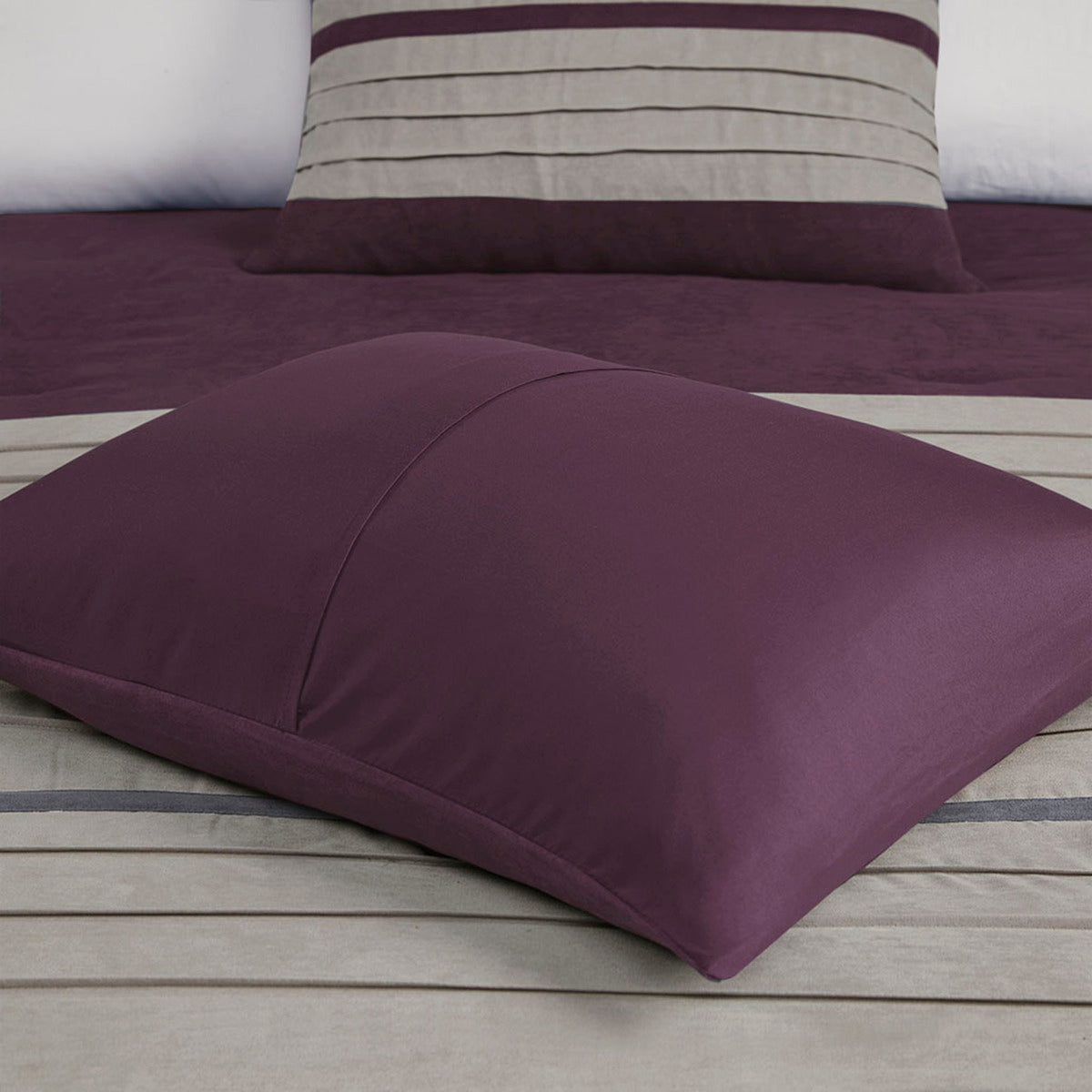 7 pc pieced faux suede comforter set Purple King by HouseOfZazla with plum comforter and matching pillow on a beige striped bed on Tampa Home & Garden Store