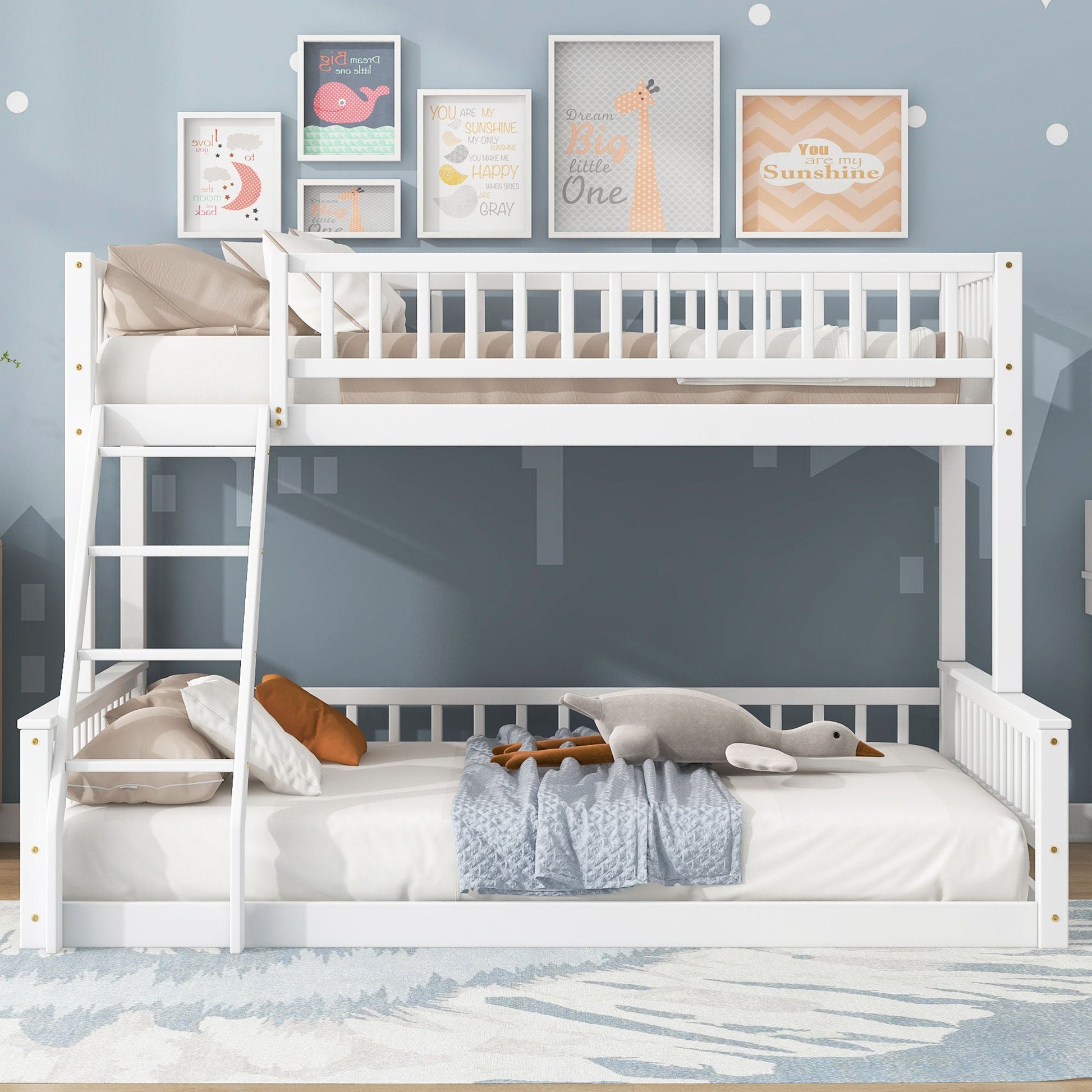 Bunk bed with ladder and guardrails, white wood, six pastel framed prints above on blue wall on Tampa Home & Garden Store