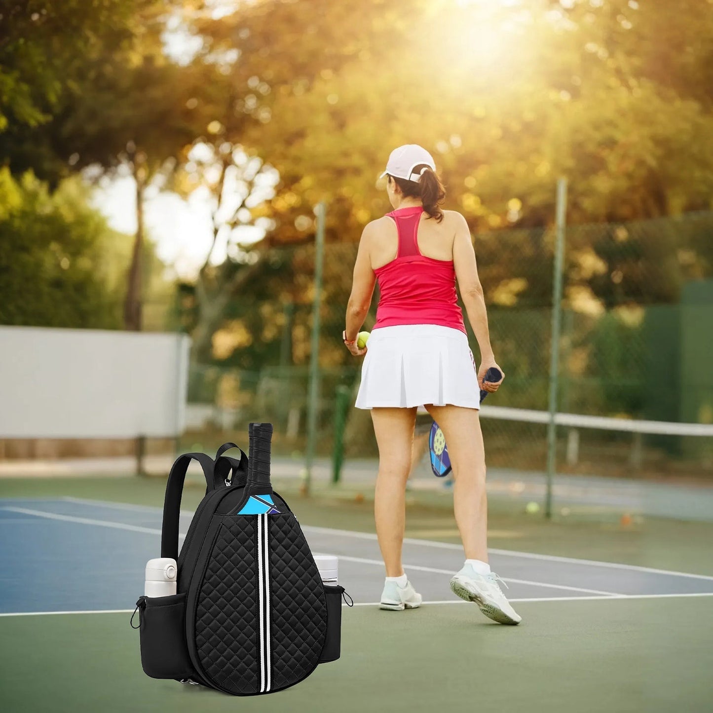 GemGear pickleball sling bag, black quilted with blue accents and water bottle pocket on Tampa Home & Garden Store