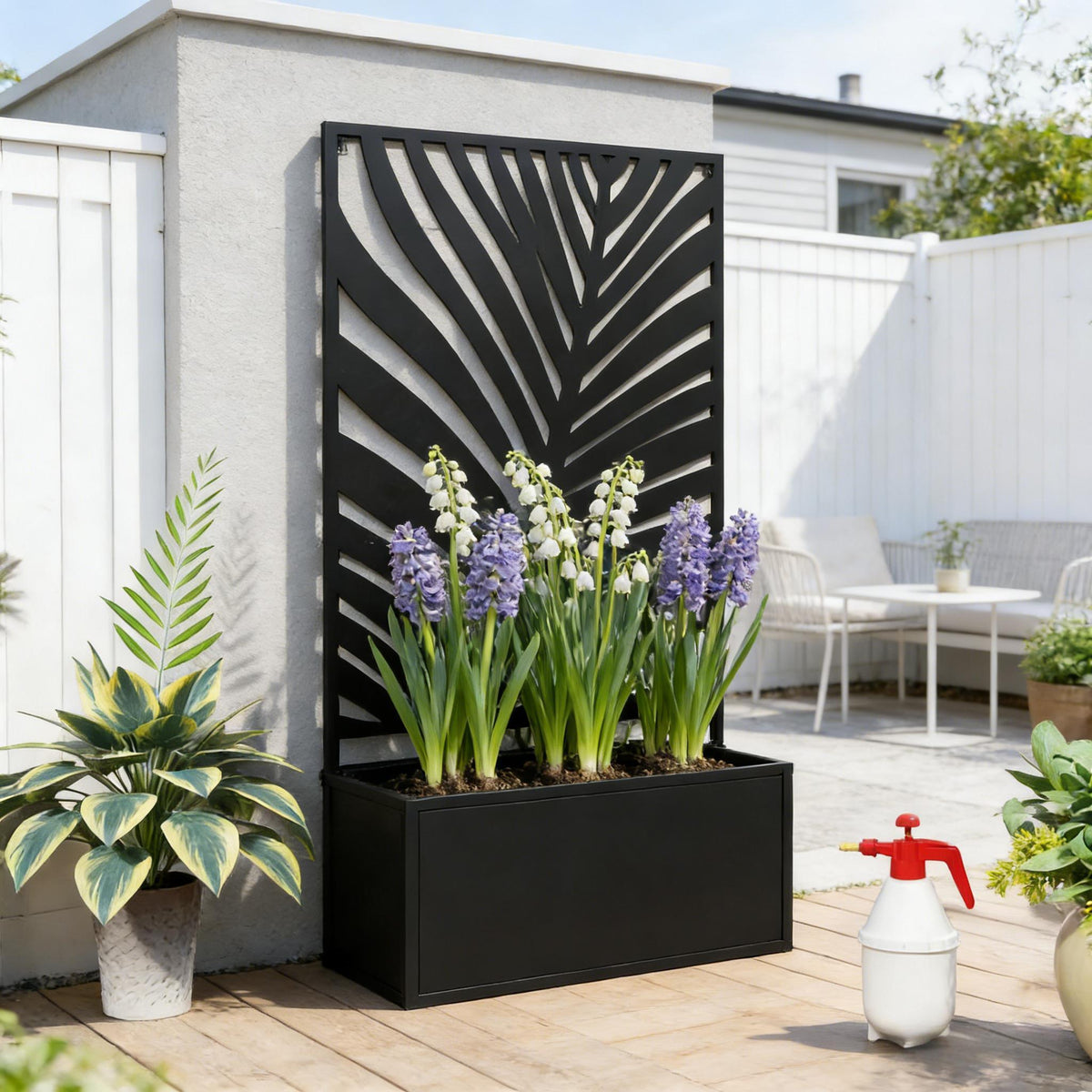 Raised metal planter bed with privacy panel by HouseOfZazla; black leaf-screen freestanding on Tampa Home & Garden Store