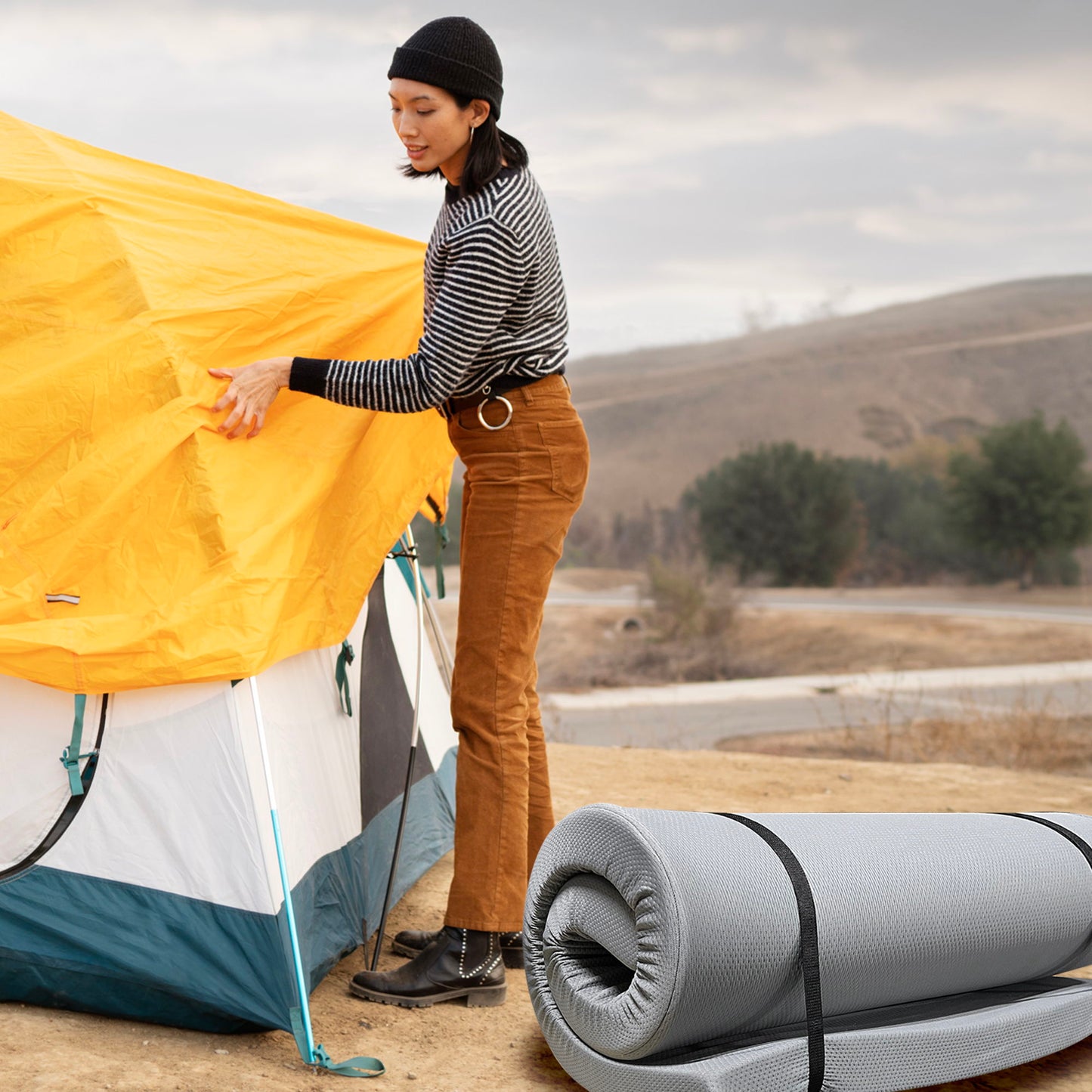 Memory Foam Camping Mattress gray roll near yellow tent at campsite on Tampa Home & Garden Store