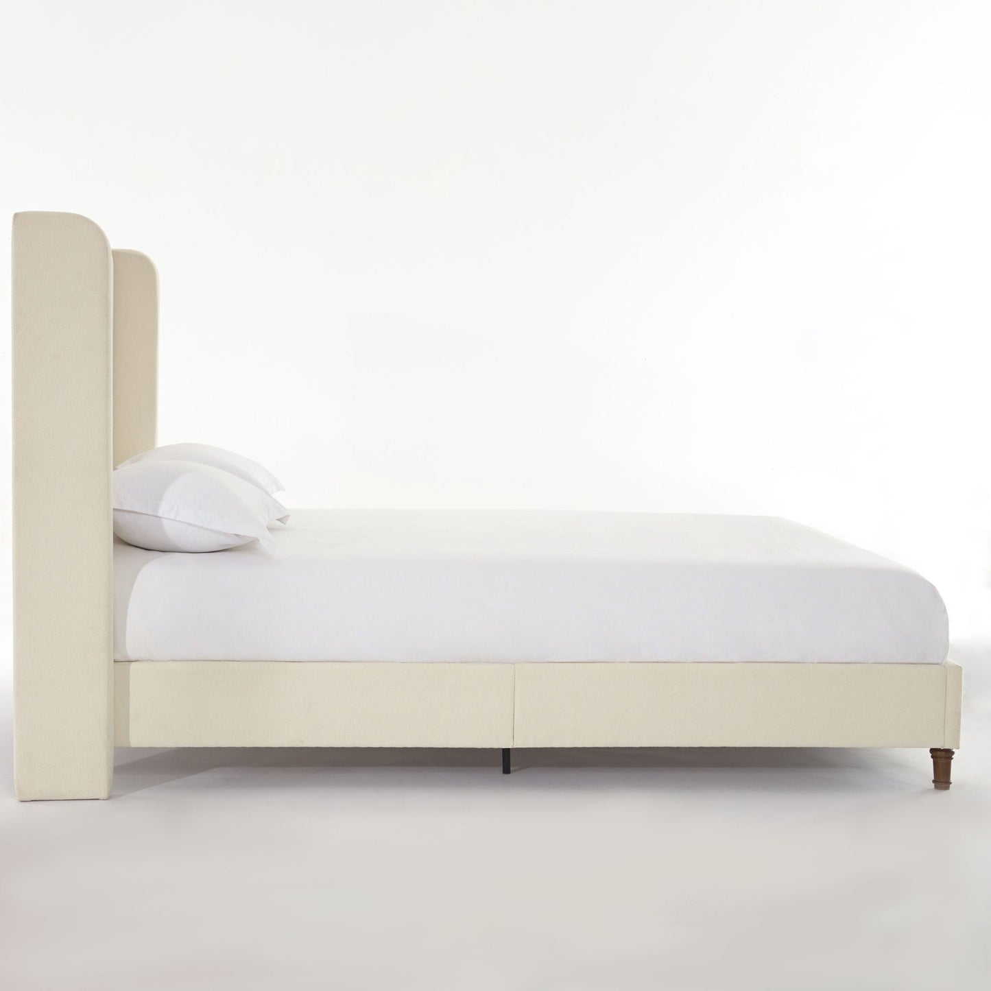 Harper tall upholstered bed with beige fabric headboard and platform bed frame, white bedding on Tampa Home & Garden Store
