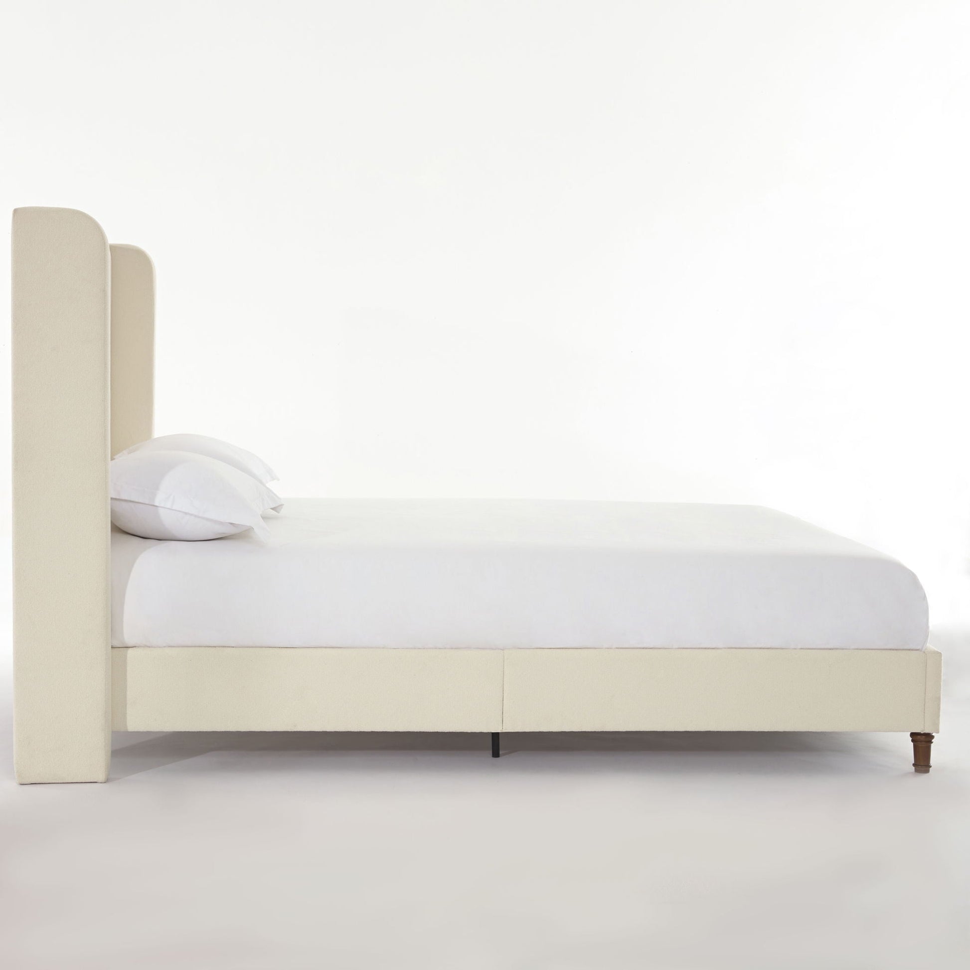 Harper tall upholstered bed with beige fabric headboard and platform bed frame, white bedding on Tampa Home & Garden Store