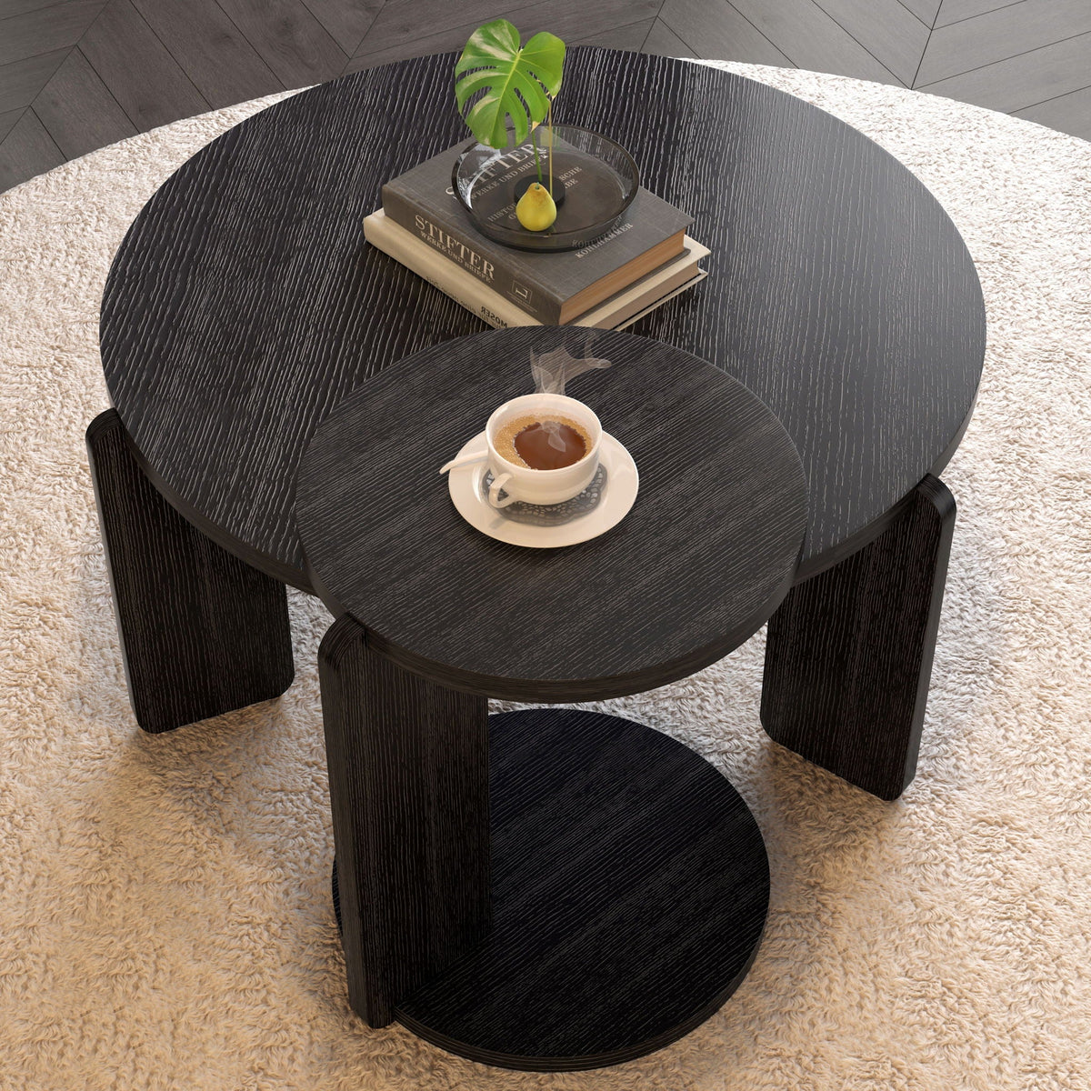 Round coffee and end table set in dark brown wood grain with a glass tray atop stacked books on Tampa Home & Garden Store