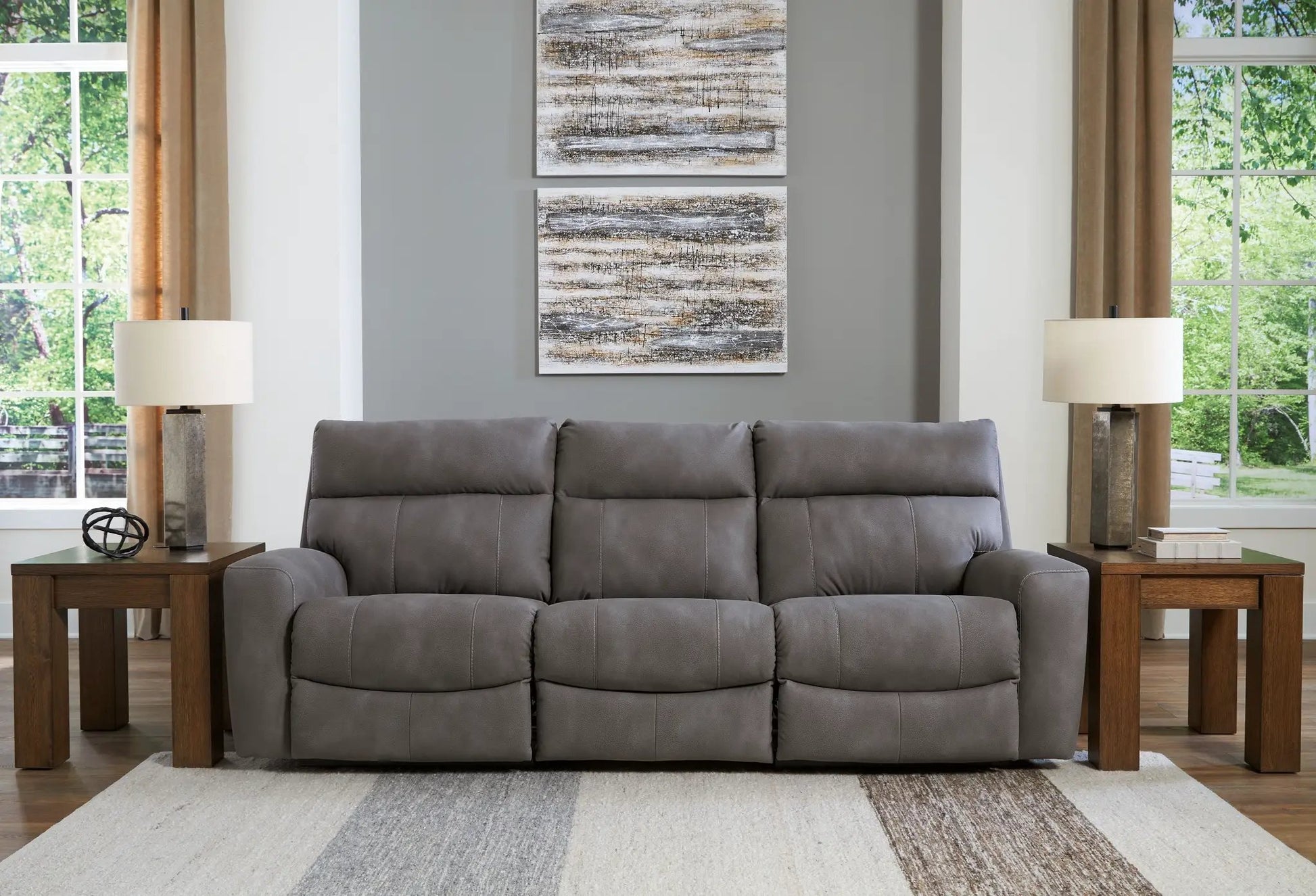 Next-Gen Durapella reclining sectional in gray upholstery with two end tables and lamps on Tampa Home & Garden Store