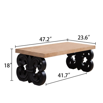 Coffee table with ornate black scroll base and rectangular natural wood top on Tampa Home & Garden Store