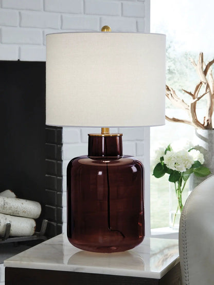 Table lamp Mette brown glass base with gold hardware and cream linen shade on marble surface on Tampa Home & Garden Store