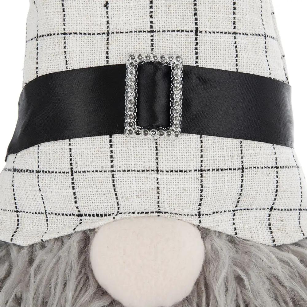 Sitting gnome figurine with beige checkered hat, black belt and rhinestone buckle, gray beard on Tampa Home & Garden Store