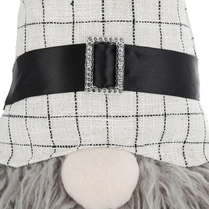 Sitting gnome figurine with beige checkered hat, black belt and rhinestone buckle, gray beard on Tampa Home & Garden Store