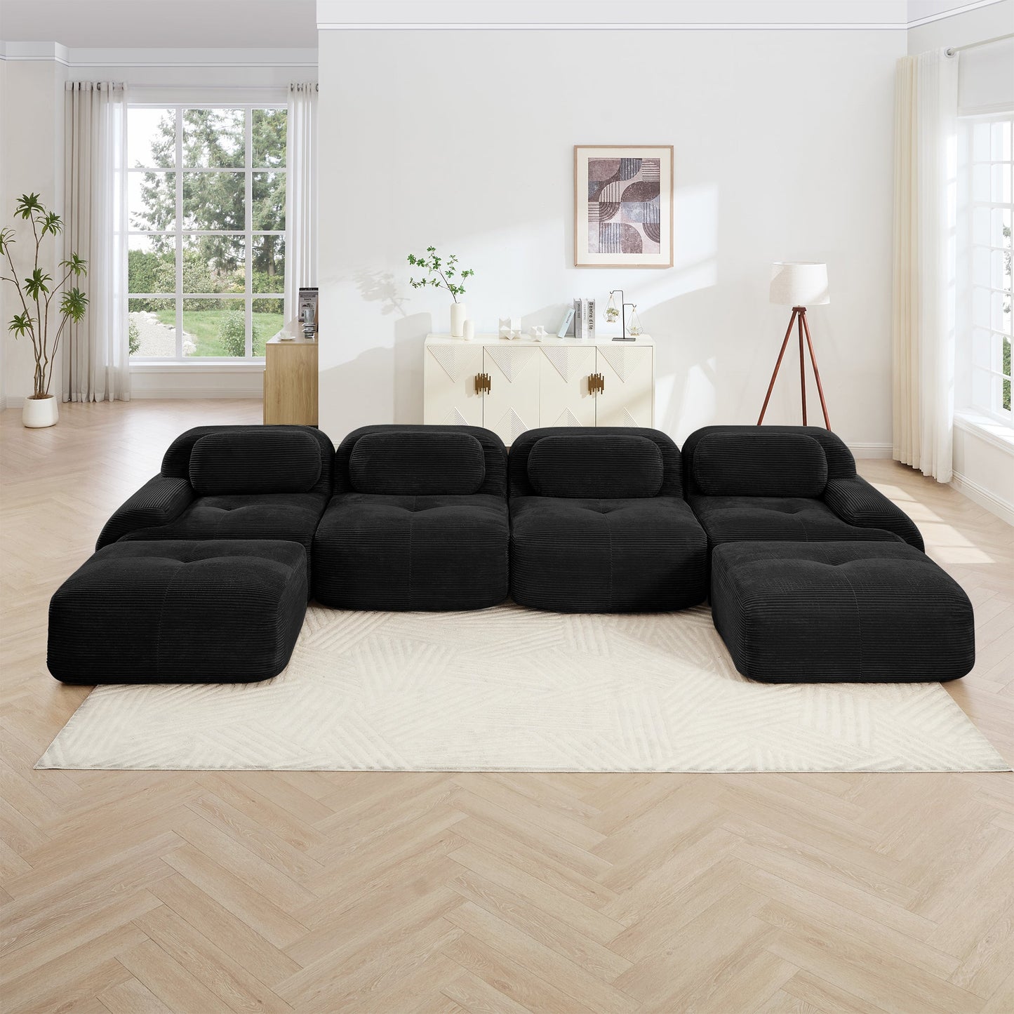 U-shaped modular sofa in black breathable corduroy fabric arranged in a bright living room on Tampa Home & Garden Store
