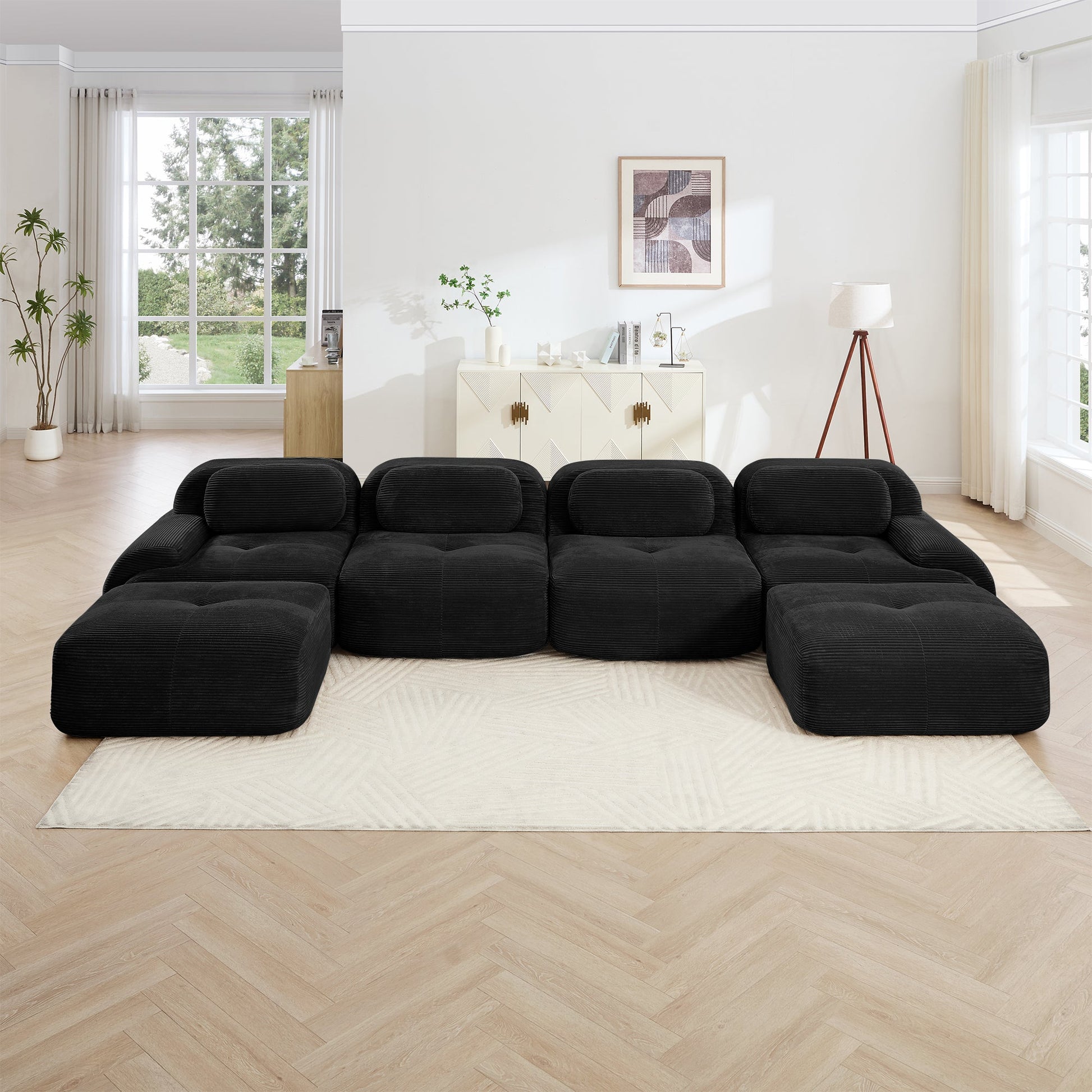 U-shaped modular sofa in black breathable corduroy fabric arranged in a bright living room on Tampa Home & Garden Store
