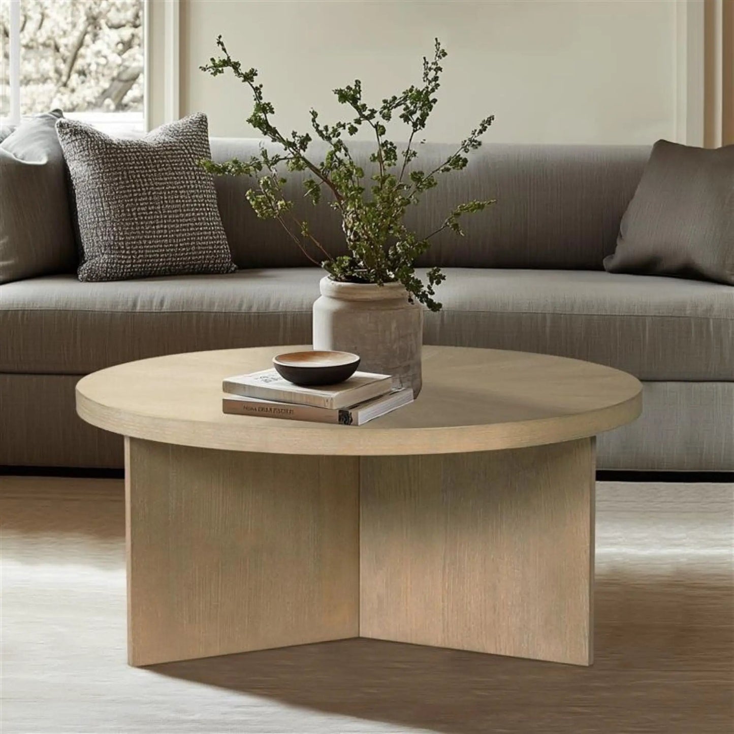 Round coffee table with solid veneer top in light wood by Unique Piece Furniture on Tampa Home & Garden Store