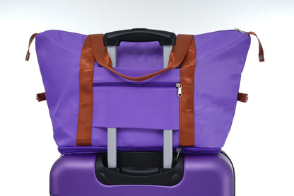 HouseOfZazla purple luggage bag with brown straps and retractable handle front zip pocket on Tampa Home & Garden Store