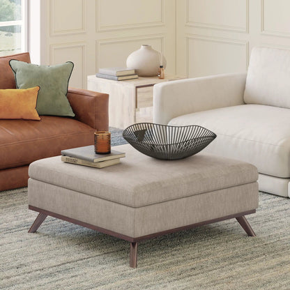 Owen Multifunctional storage ottoman in beige fabric with books and a black wire bowl on Tampa Home & Garden Store