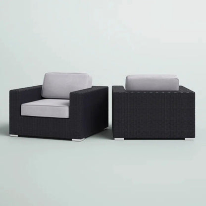 Pair of black wicker patio arm chairs with light gray cushions by Unique Piece Furniture on Tampa Home & Garden Store
