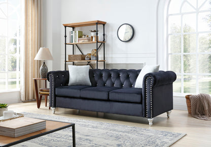 the Raisa Tufted Sofa and Nailhead Accents