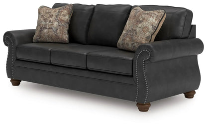 Chasemore Sofa stationary sofa with two pillows, dark gray upholstery and nailhead trim on Tampa Home & Garden Store