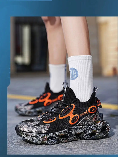 Galaxy Blade Sneaker pair, black knit upper with orange accents and marbled sole on Tampa Home & Garden Store