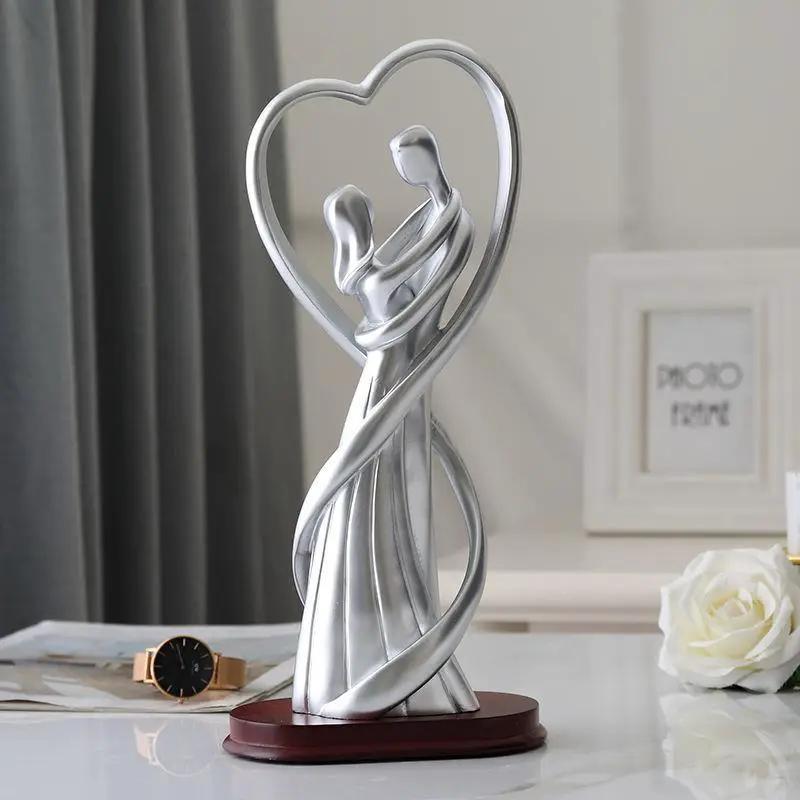 Silver embrace figurine of entwined couple forming a heart on base, FLIPSTYLEZLLC gift statue on Tampa Home & Garden Store