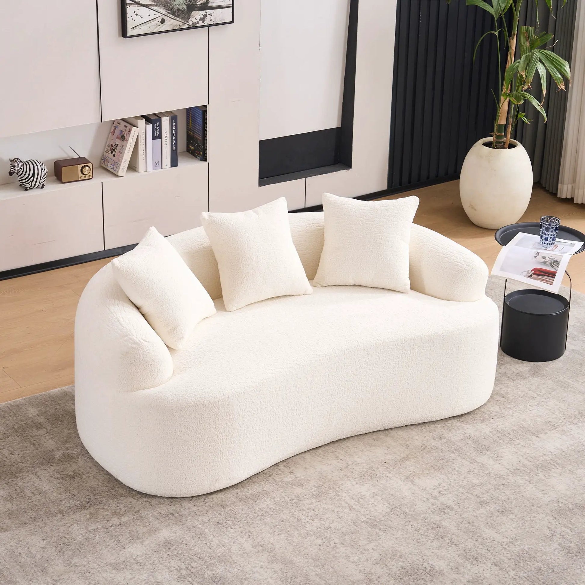 Round loveseat sofa, compact design, white textured fabric with cushions in modern living space on Tampa Home & Garden Store