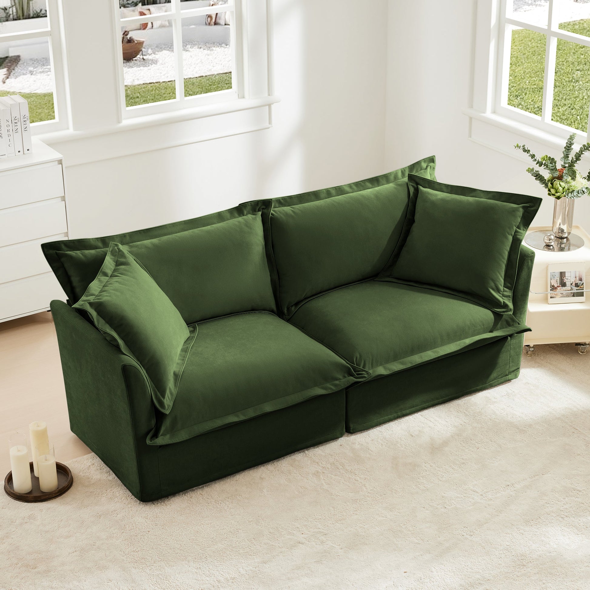 Modern Slipcovered 2-Seat Sofa by HouseOfZazla in green velvet in a white room with windows on Tampa Home & Garden Store