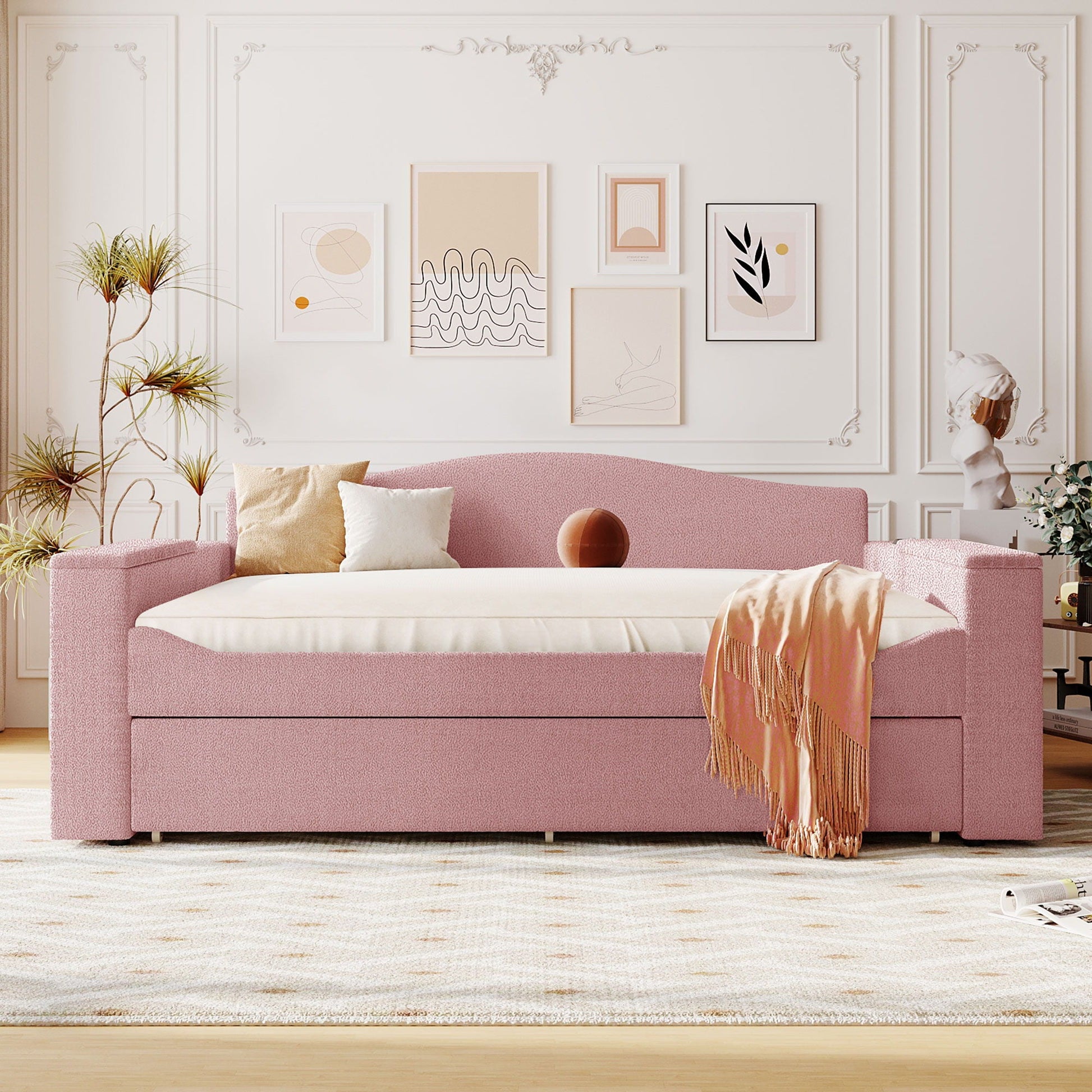 Upholstered pink daybed with storage armrests and built-in trundle in chic living room on Tampa Home & Garden Store