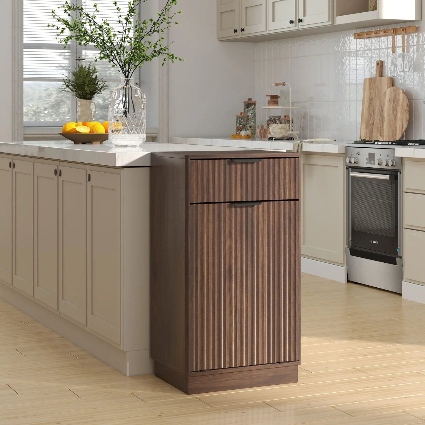 Tilt Out Trash Can Cabinet With Wave Textured Drawer & Pull Out Bin on a beige kitchen island on Tampa Home & Garden Store
