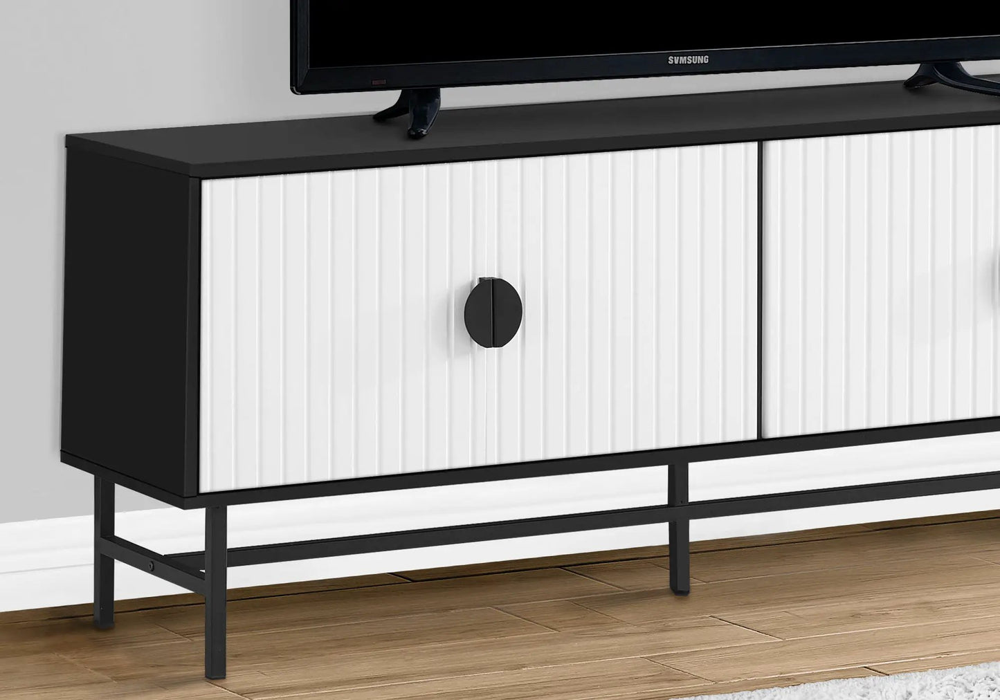 TV stand console with storage cabinet, black metal frame and white vertical ribbed doors on Tampa Home & Garden Store
