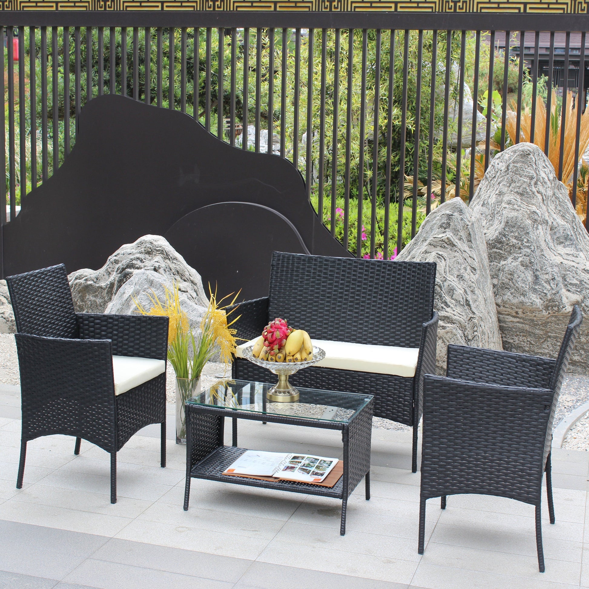 4 pc rattan outdoor furniture set with black wicker chairs and glass coffee table on Tampa Home & Garden Store
