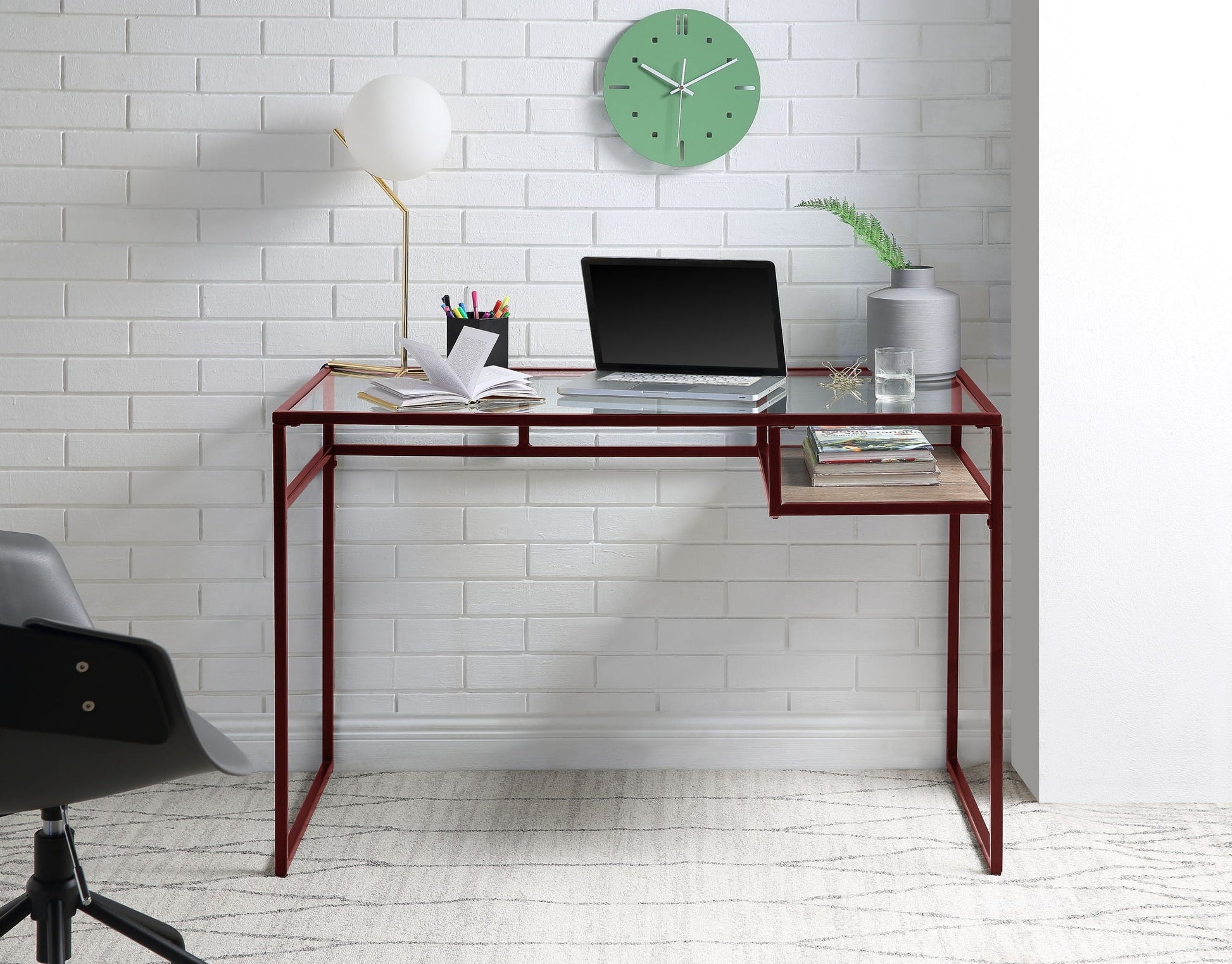 Yasin Glass Top Writing Desk with red metal legs and glass surface, shown with laptop on Tampa Home & Garden Store
