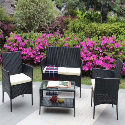 4-piece rattan outdoor furniture set with cream cushions and glass coffee table on Tampa Home & Garden Store