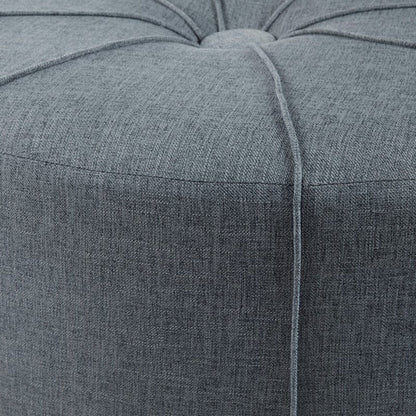 Large blue upholstered cocktail ottoman with a centered button tuft on Tampa Home & Garden Store