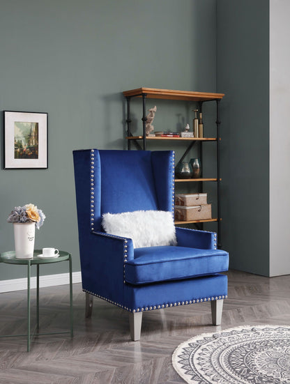 Traditional accent arm chair in blue velvet with nailhead trim and light gray legs on Tampa Home & Garden Store