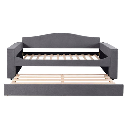 Upholstered gray daybed with curved back and square storage armrests, exposed wooden slat trundle on Tampa Home & Garden Store