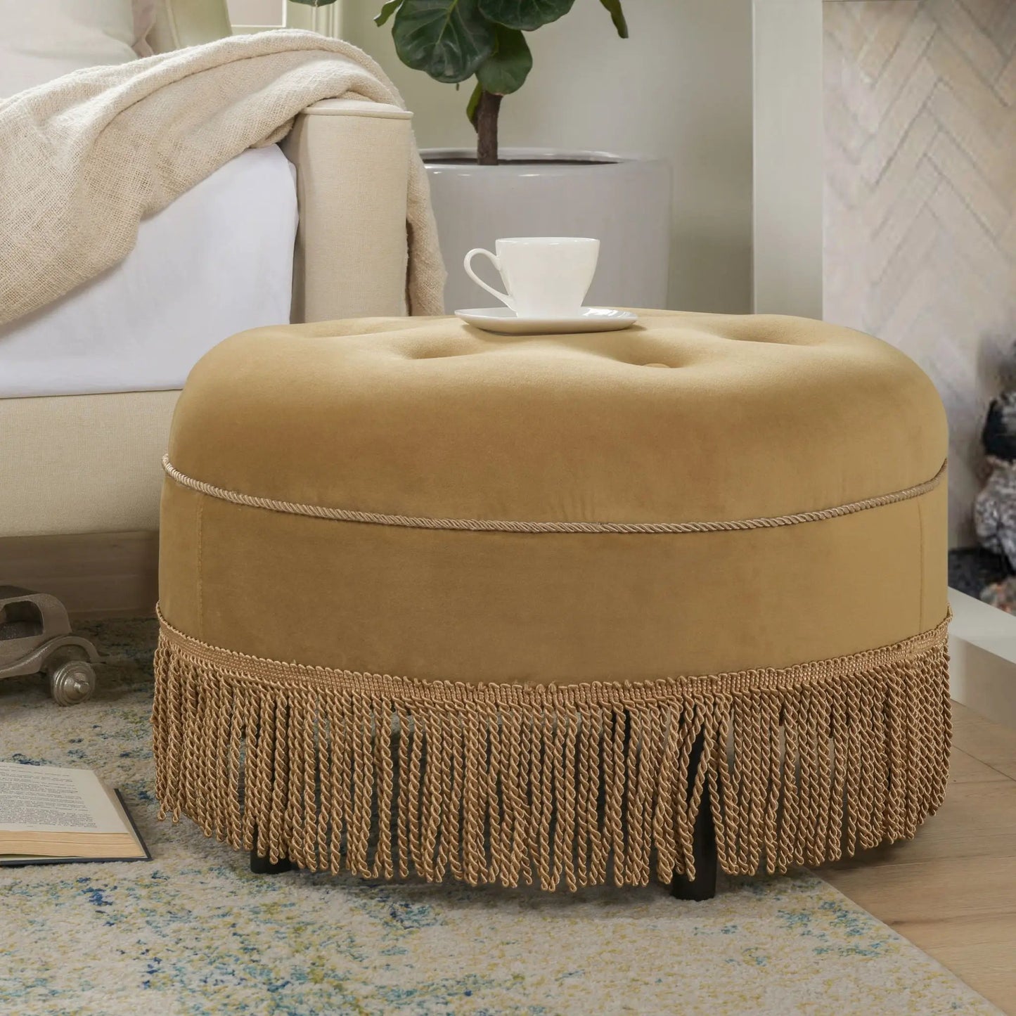 Yolanda round camel-taupe upholstered ottoman with fringe tassels by Unique Piece Furniture on Tampa Home & Garden Store