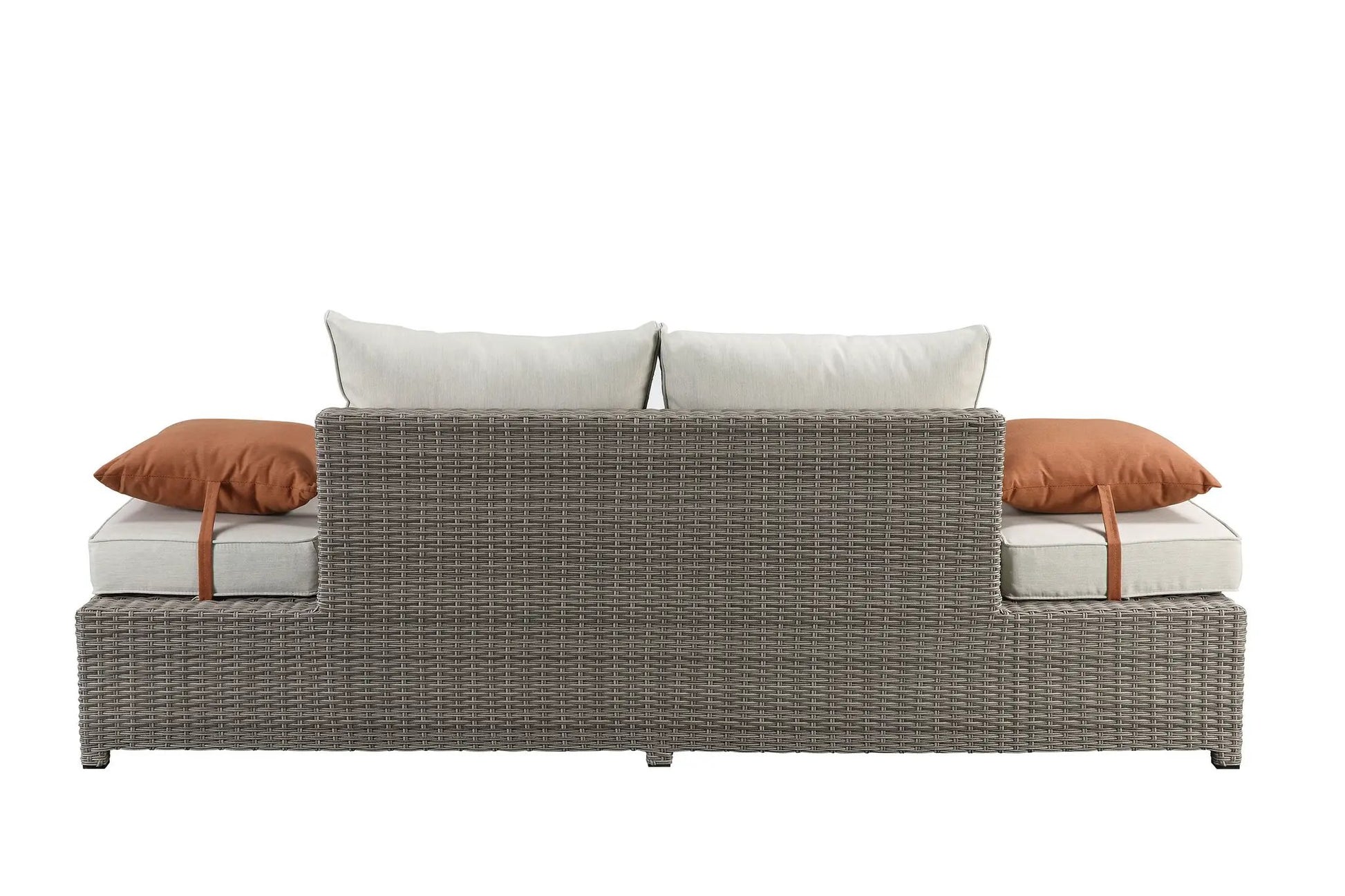Salena all-weather wicker patio sofa & ottoman with beige cushions and 2 rust-orange pillows on Tampa Home & Garden Store
