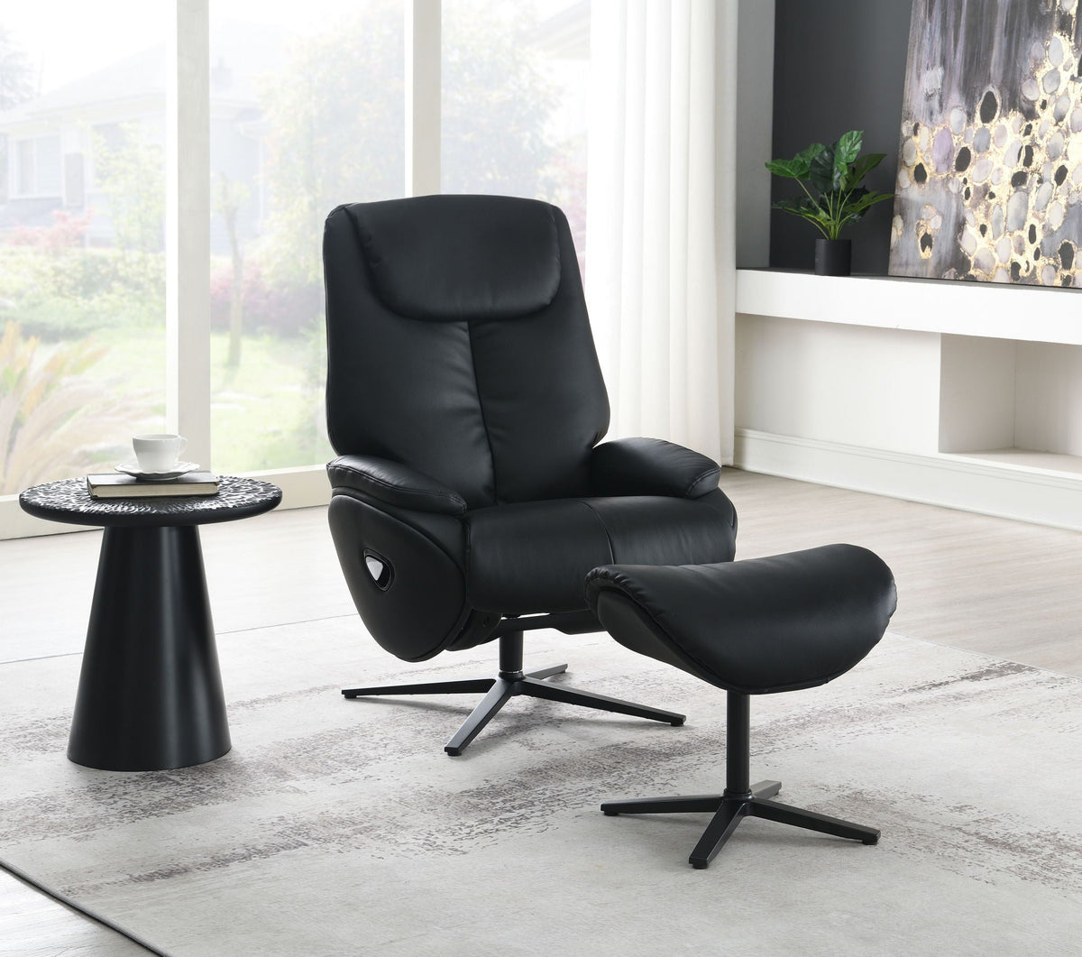 Top grain leather reclining chair and ottoman with swivel in black, modern home office setting on Tampa Home & Garden Store