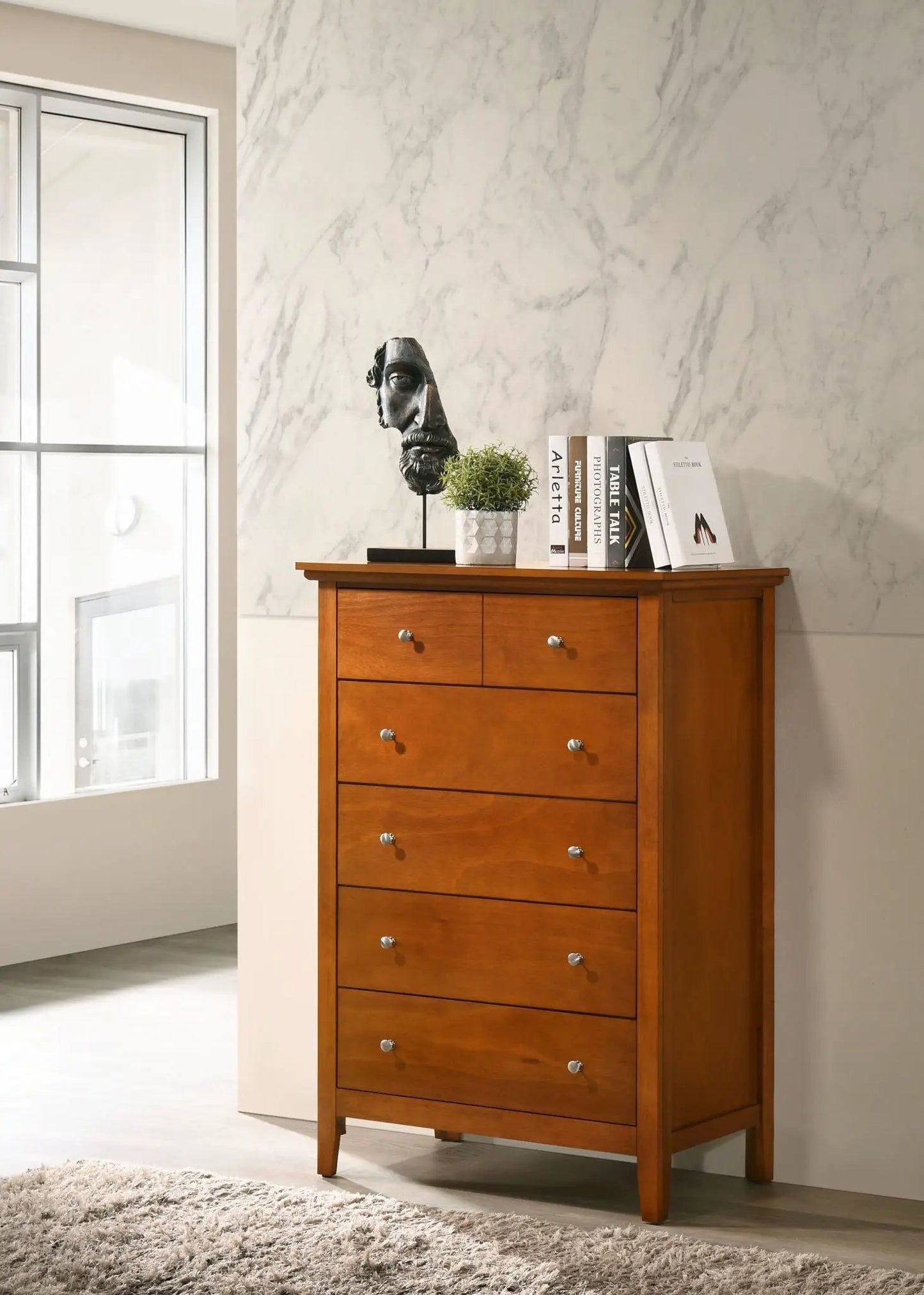Hammond - Chest accent cabinet in warm wood by Unique Piece Furniture; bust, plant, books on Tampa Home & Garden Store