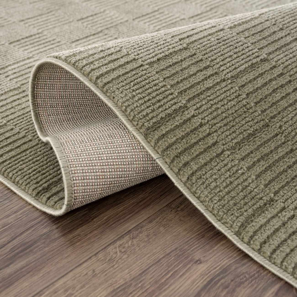 Kazuma Green Washable Area Rug, green textured loop pile with rolled edge, Boutique Rugs on Tampa Home & Garden Store